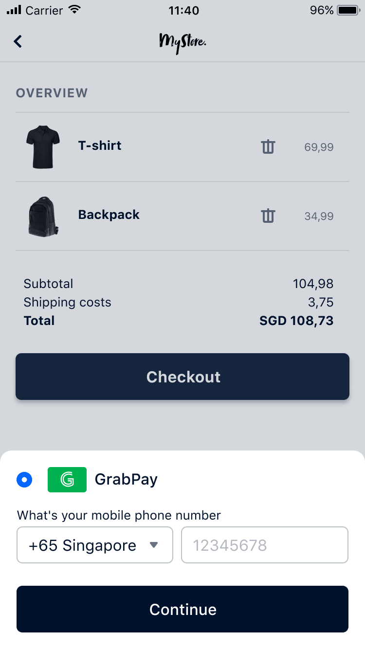 Carrello acquisti mobile con maglietta e zaino elencati, mostra prezzo totale in SGD e opzione di pagamento GrabPay