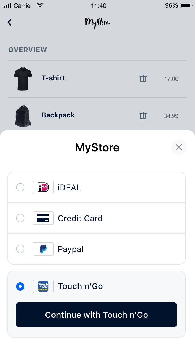 Schermo mobile che mostra una pagina di checkout del negozio online con opzioni di pagamento tra cui iDEAL, carta di credito, Paypal e Touch n'Go